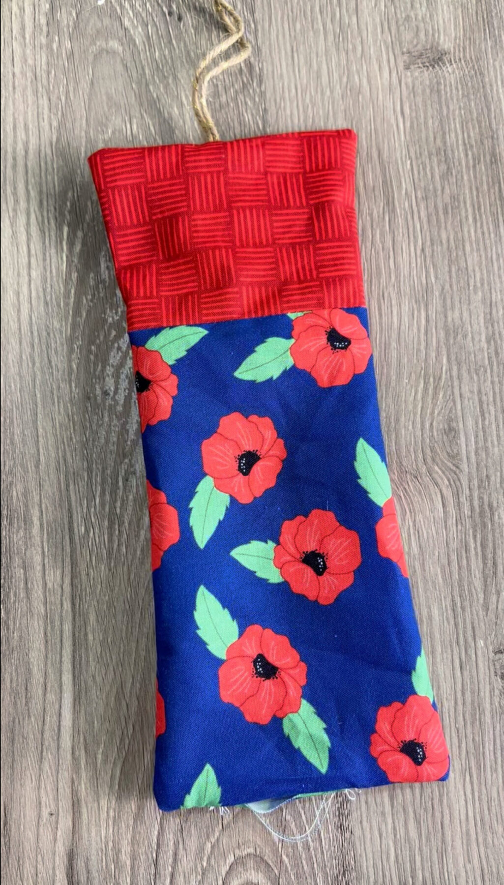 Image contains a fabric firecracker prior to being filled with Poly-Fil.